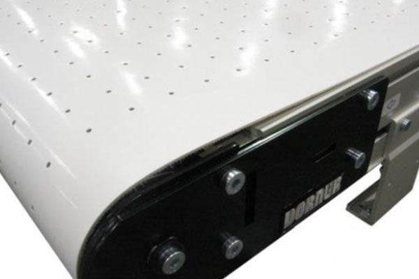 Vacuum belt conveyors